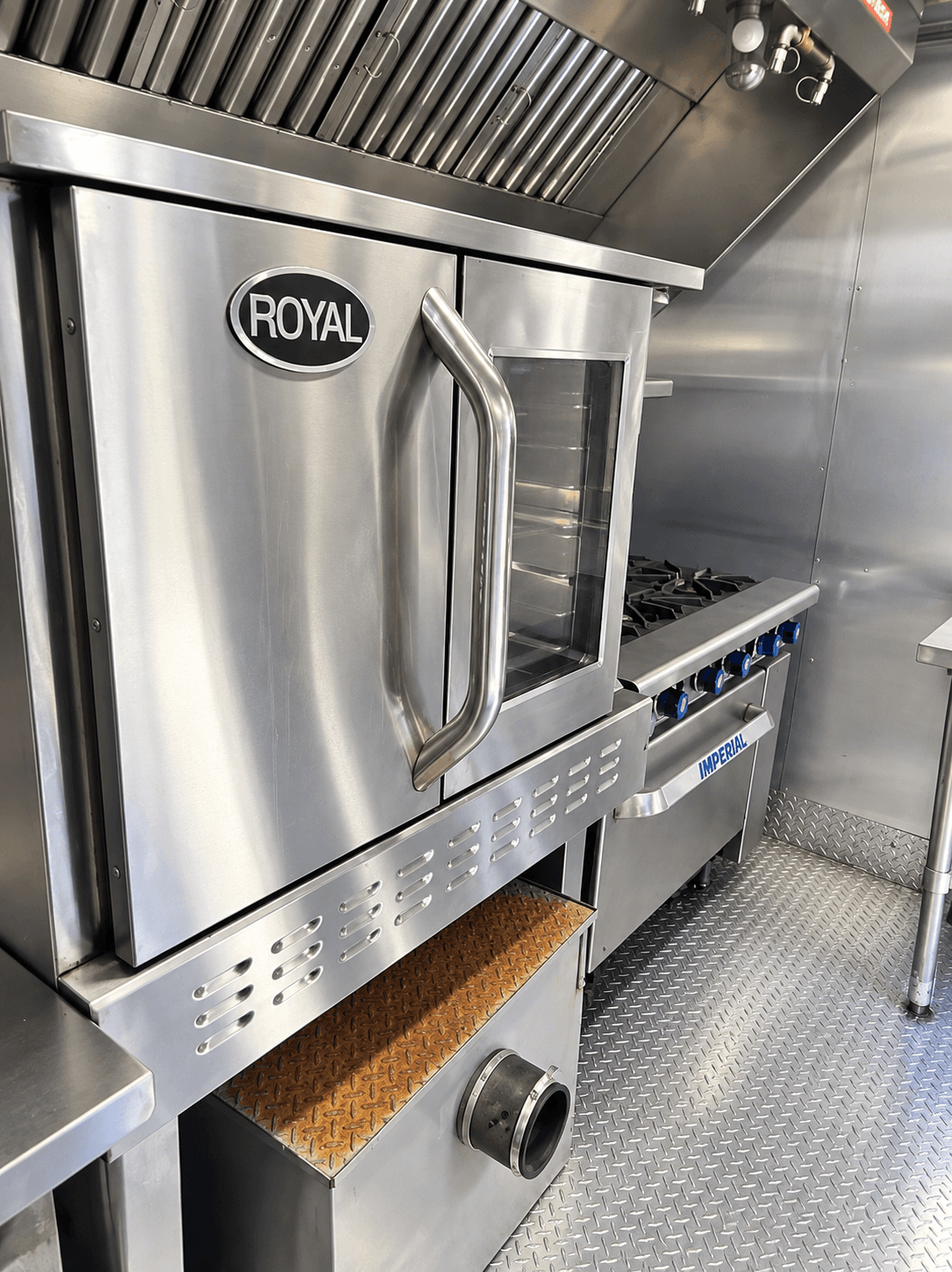 Stainless commercial refrigerators inside a kitchen trailer